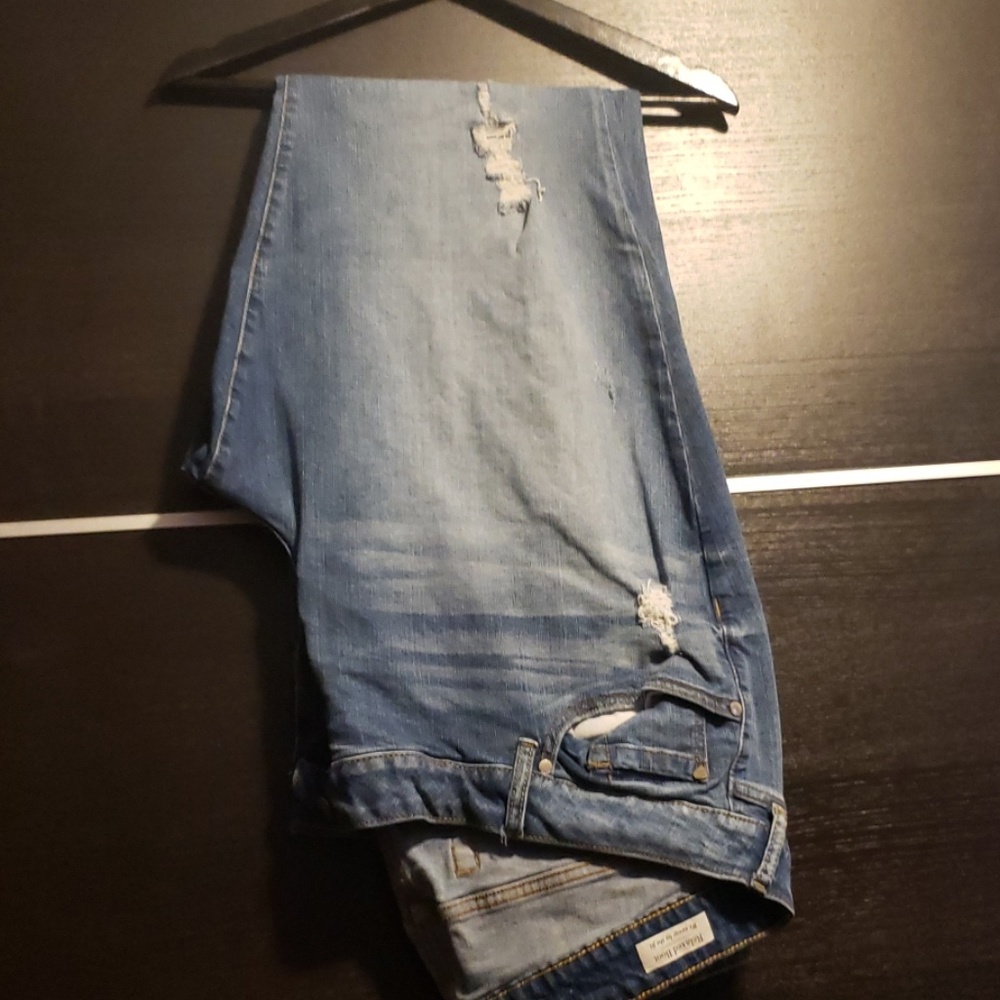 Distressed lighter/medium wash jeans